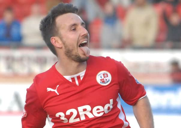 Crawley's Matt Tubbs scores from the penalty spot to win against Peterborough Utd (Pic by Jon Rigby) SUS-140303-144721002