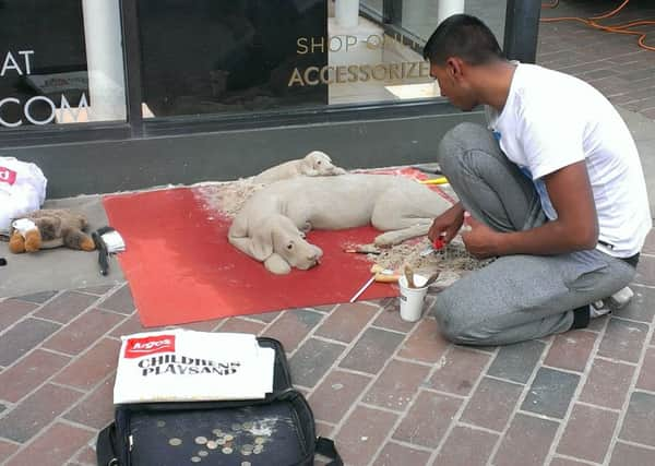 Sand sculptor in Montague Street