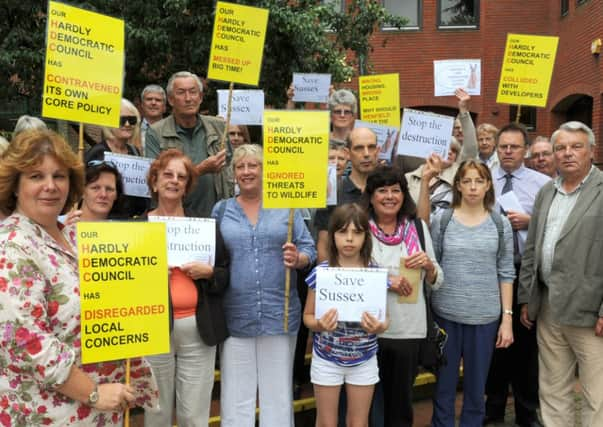 JPCT 170712 Group of Henfield protestors outside Horsham Park North office re housing development plans going before committee. Photo by Derek Martin ENGSUS00120120717140530