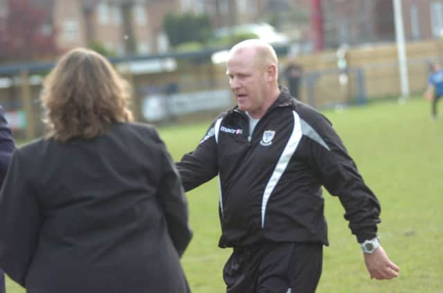 Departed Bexhill United manager Kenny McCreadie collects his medal at the recent Sussex Division Two Challenge Cup final (SUS-140515-190048002)