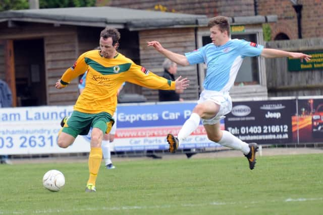 Sam Cruttwell (right) has become the latest first team regular to commit to Hastings United for next season. Picture by Steve Cobb (SUS-140417-185756002)