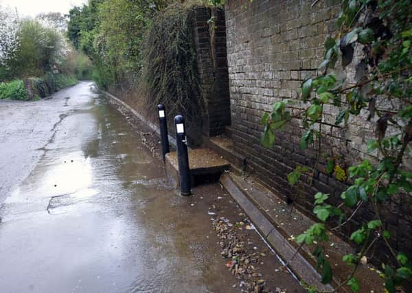 Pot holes and flooding in Mouse Lane