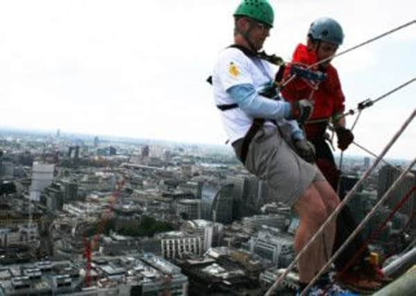 David Burland abseils down Broadgate Tower SUS-140616-153655001