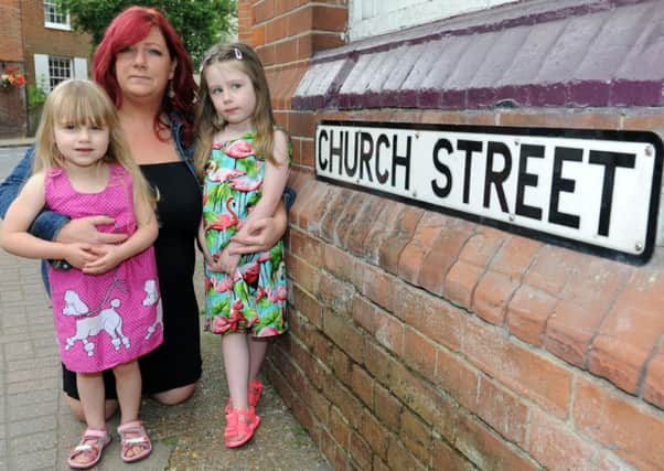 JPCT 200614 S14260707x  Sarah Woods with children Charlotte, 3, and Georgina,4, in Church Street, Henfield. A short waklk from St Peter's Primary school -photo by Steve Cobb SUS-140620-091822001