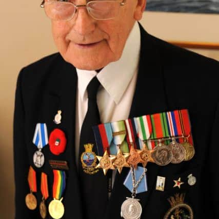 JPCT 030714 S14280026x Horsham. Tony Snelling, 91, one of the last surviving D-Day veterans met the Queen at a Buckingham Palace garden party - photo by Steve Cobb SUS-140307-123746001