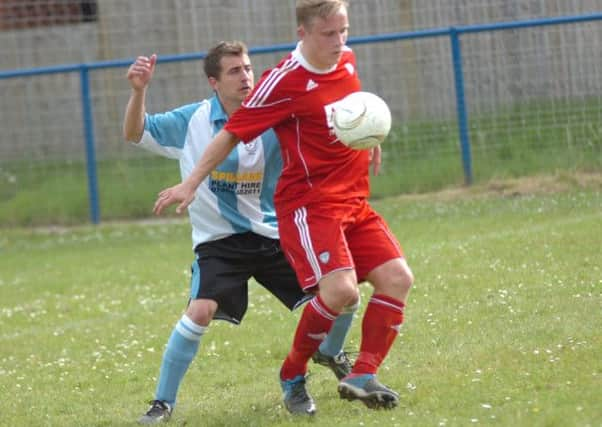 Bexhill United (blue and white shirt) will make their first ever appearance in the FA Vase during the coming season