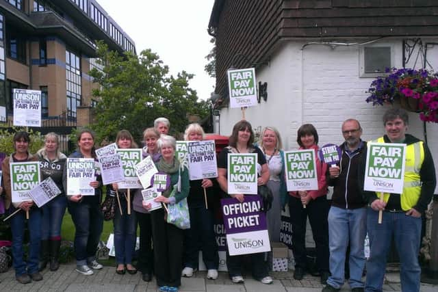 West Sussex County Council workers strike outside County Hall North, Horsham, as part of Unison's protest againt the Government pay deal SUS-141007-122713001