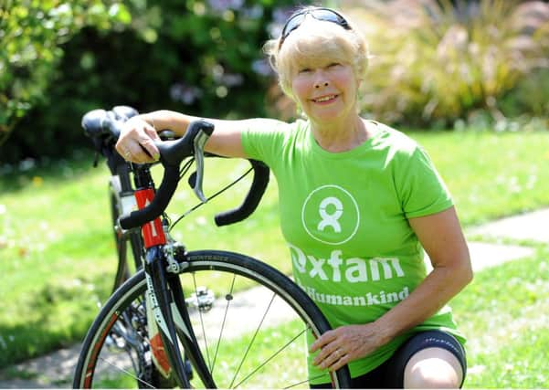 JPCT 160714 S14291233x Penny Bullimore, Thakeham Parish councillor is cycling a 100 mile round trip from London to Surrey and back for Oxfam. -photo by Steve Cobb SUS-140716-123710001