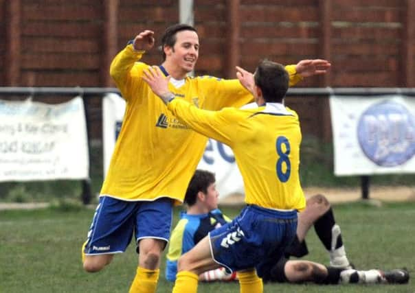 Charlie Walker celebrates  scoring for Lancing