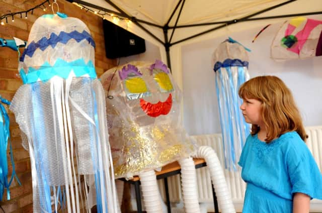 Elsie Ballance with some lanterns made by children