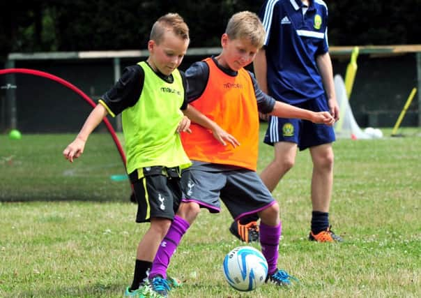 25/7/14- Summer football coaching at Westfield Football Club SUS-140725-123947001