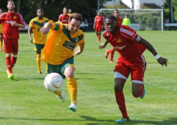 Horsham's Jamie Cade in action against Merstham