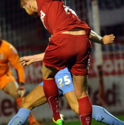 Crawley Town's Matt Harrold shoots towards goal against Cambridge United (Pic by Jon Rigby) SUS-140309-000610002