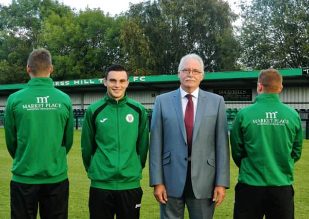 Chris Goldfinch, with Hillians players Rob OToole, Dann Perry and Pat Harding