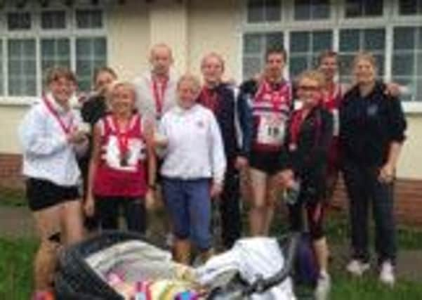 Harriers of all generations celebrate their success at Hellingly.