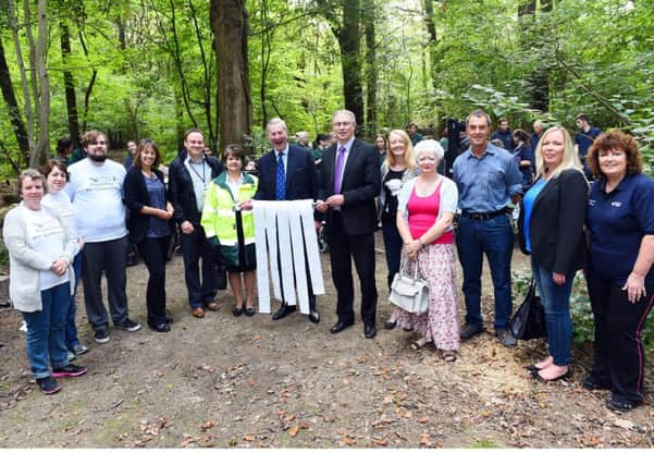 Ingfield Manor School. Ingfield Manor School, opening of their, "Fully accessible and substanable composting toilet", in their woodlands project area.Pictured are sponsors and volunteer of the project and L-R( centre), Mark Woodhouse ( Chairman of the Community Chest)  and  Gary Shipton (Editor in Chief of the West Sussex County Times),  Billinghurst. Picture : Liz Pearce. LP260914IM08 SUS-140927-123454008