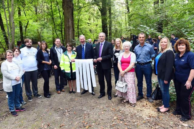 Ingfield Manor School. Ingfield Manor School, opening of their, "Fully accessible and substanable composting toilet", in their woodlands project area.Pictured are sponsors and volunteer of the project and L-R( centre), Mark Woodhouse ( Chairman of the Community Chest)  and  Gary Shipton (Editor in Chief of the West Sussex County Times),  Billinghurst. Picture : Liz Pearce. LP260914IM08 SUS-140927-123454008