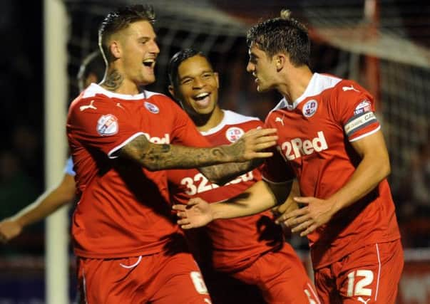 Crawley Town's Joe Walsh scores against Bradford City (Pic by Jon Rigby) SUS-140819-235935002