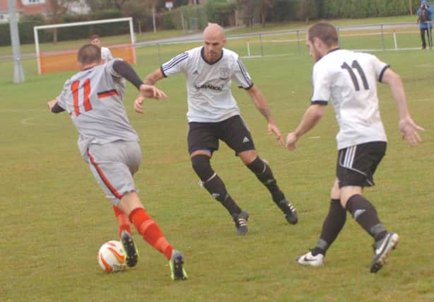 Action from Bexhill United's game against Rochester United in the FA Vase on Saturday. Picture by Simon Newstead (SUS-140710-093914002)