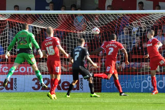 Michael Smith's shot has just found the back of the met at Crawley.Photo Jon Rigby.