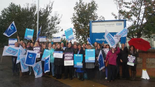 NHS workers on the picket line outside Worthing Hospital this morning SUS-141013-112932001