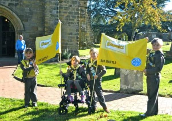 Representatives of the 3rd and 5th Battle Brownies presented their new flags at the Harvest Festival service at St Mary's Parish Church in Battle on Sunday 5th October SUS-141014-152226001