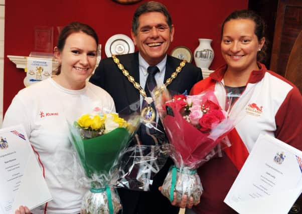 JPCT 221014 S14450006x Horsham Commonwealth Games winners congratulated by Cllr Brian OConnell, Chairman of Horsham District Council. Sian Honnor, Gold Medal Winner in Womens Triple Lawn Bowls and Jade Lally, Bronze Medal Winner in Womens Discus -photo by Steve Cobb SUS-141023-084837001