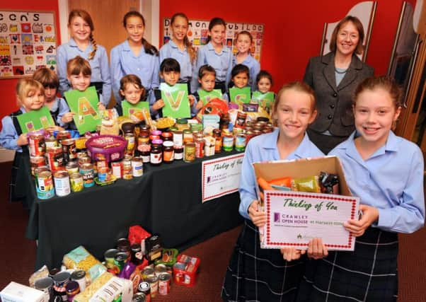 JPCT 101014 S14430042x Farlington school hosting their harvest festival. Prep school head mistress Frances Mwale with pupils -photo by Steve Cobb SUS-141010-111032001