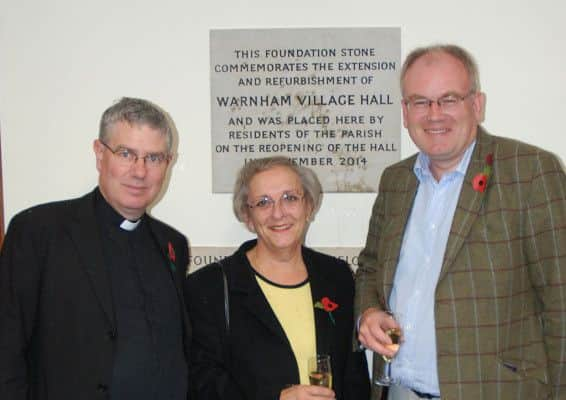 Residents of Warnham Village Hall celebrating its grand reopening (photo by Roo Ball). Christopher Loveless Reverend of St Margaret's Church, Gytha Hodgson, widow of Mick Hodgson, and Stuart Ritchie, chairman of the village hall's management committee. SUS-141011-114819001