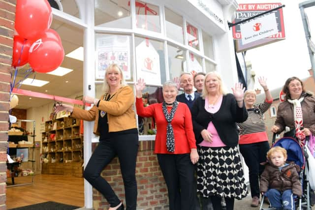 Mayor Jill Long cuts the ribbon to open the store  D14472650a