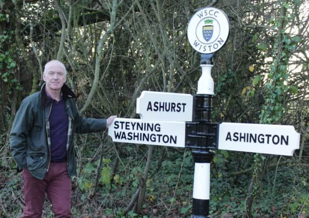 Ken Newton with the restored fingerpost in Wiston