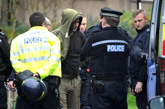 Man arrested and ecorted from a property in West Park Cresent, Burgess Hill 25.11.14
Pic Steve Robards