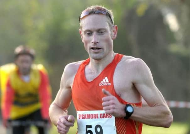 James Baker on his way to winning the Hayling ten-mile race   Picture by Mick Young 143349-10