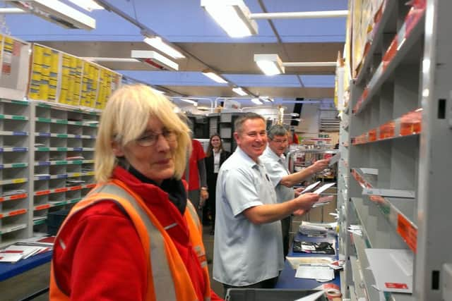 Horsham Delivery office posties sorting the Christmas mail - L-R Jane Woodcock, Martin Melaugh an Chris Hollingsworth - picture by Anna Coe