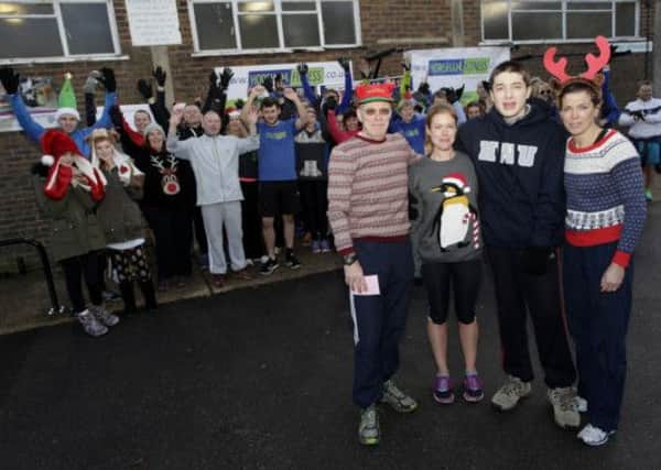 Horsham Fitness partner Mark Sillett, QEII teacher Hayley Worman, QEII student Simon Tomlinson and Horsham Fitness partner Katie Warman in front of event participants SUS-141216-104949001