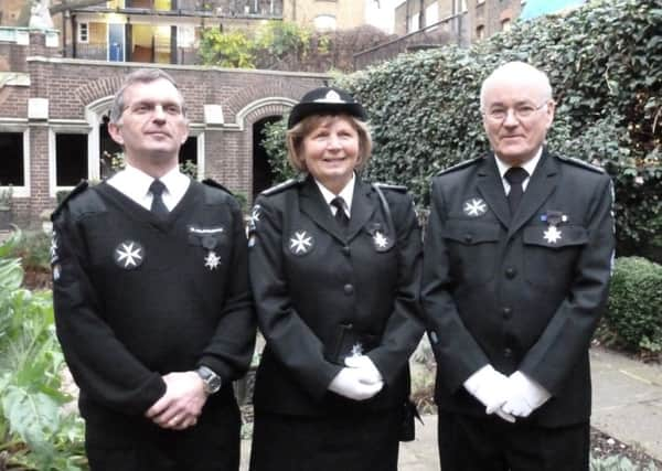 Keith Dale, Cynthia White and Steve Strange in the grounds of the Priory Church London following the Investiture SUS-141216-130717001