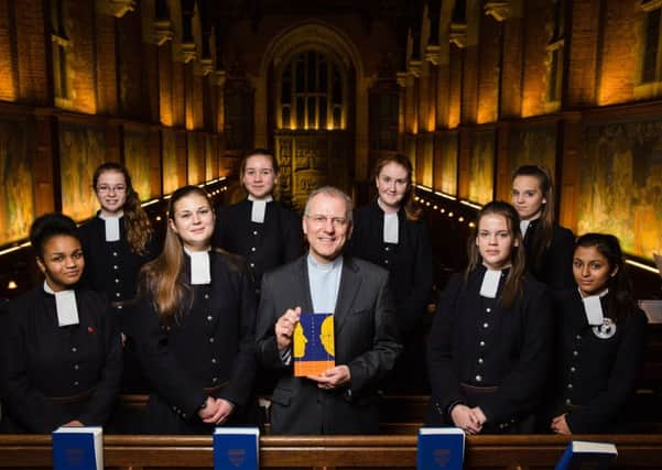 Reverend Stephen Golding with a group of pupils from Christs Hospital, who assisted him with the illustrations contained within the book SUS-141218-152155001