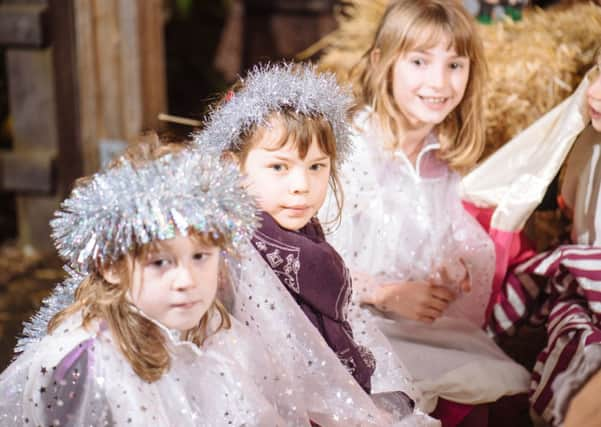 Carols in the car park at Billingshurst Primary School by Alan Wright SUS-141223-145021001