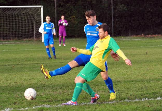 Westfield manager Jethro Warren in action against Haywards Heath Town last weekend. Picture by Steve Hunnisett (SUS-141220-162426002)