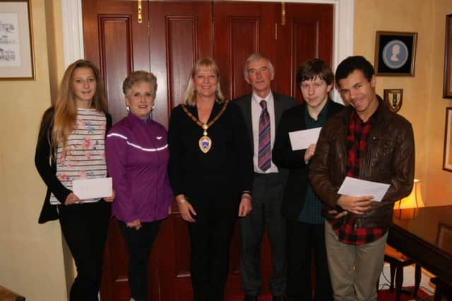 Left to right: Ellie Hack, Daphne Belt, Littlehampton mayor Jill Long, councillor Malcolm Belchamber, Caleb Grace and Jordan Okonta who won the Sussex Sports Awards disabled sports personality of the year SUS-141230-171604001