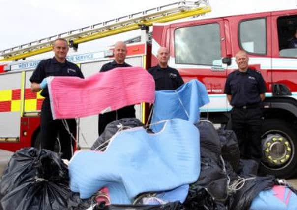 West Sussex firefighters with some faulty electric blankets during an earlier safety campaign in the county. ENGSUS00120121009170733