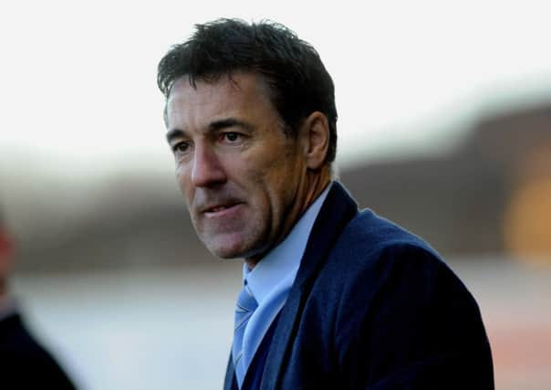 Dean Saunders the new Crawley Town manager watches his side against Colchester (Pic by Jon Rigby) PPP-141228-185117004