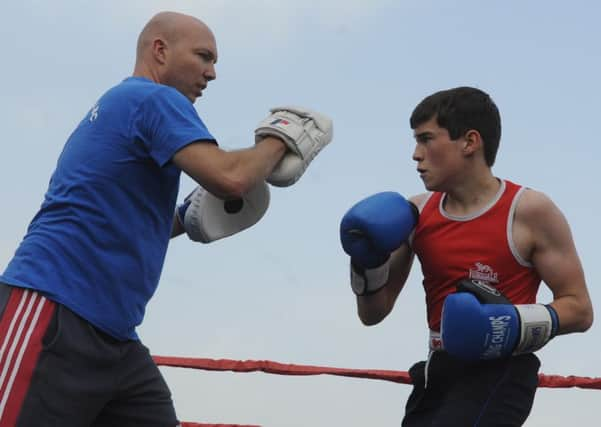 Coach Jon Mills with boxer Shawn Thompson