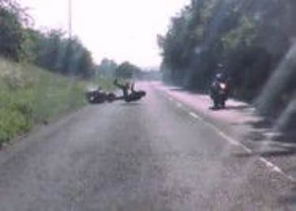 Horsham motorcyclist Lee Oliver falls from his motorcycle in Uckfield