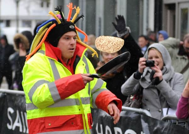 JPCT 180214 S14081721x Horsham pancake races.  -photo by Steve Cobb SUS-140218-154120001