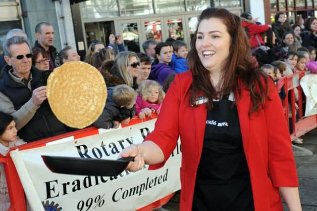 JPCT 170215 S15071126x Horsham Pancake Races, Carfax, Rotary Club. Beales team -photo by Steve Cobb SUS-150217-141016001