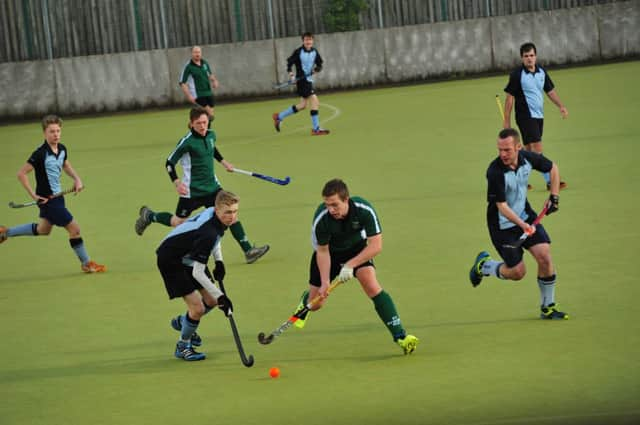 Harry Reece (left) and Gavin Cload (right) keep a close eye on a St Francis opponent. Picture by Simon Newstead (SUS-150221-221044002)