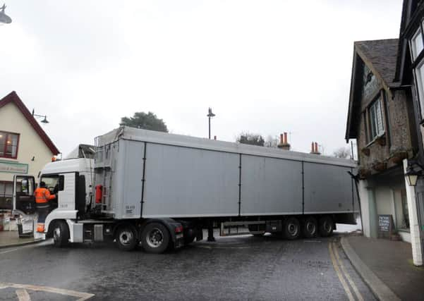 JPCT 130215 S15070272x Storrington. Lorry collision with shop -photo by Steve Cobb SUS-150213-135026001