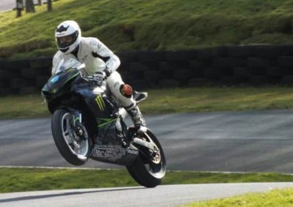 Sam Osborne testing his new bike at Cadwell Park