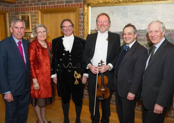 From L-R Simon Turpitt, St Catherines Hospice Chairman, Caroline Lucas, Jonathan Lucas, High Sheriff of West Sussex, Andrew Bernardi, musician, Revd Rupert Toovey, event sponsor and Peter Jennings, Fundraising and Marketing Director at St Catherines Hospice. SUS-150403-105409001